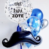 a balloon bouquet with a mustache and blue balloons