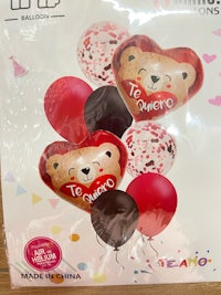 a package of balloons with a teddy bear and balloons