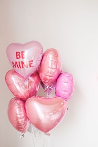 valentine's day balloons with the words be mine